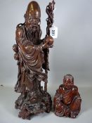 A WELL CARVED CHINESE WOODEN FIGURE OF SHOU LAO and one other, the Daoist God with his staff in