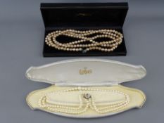 A CASED TWIN ROW LOTUS PEARL NECKLACE of graduated beads, with nine carat gold circular seed pearl