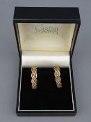 A PAIR OF NINE CARAT CLOGAU GOLD TWIST HOOP EARRINGS, circa 1995, 6.5 grms gross