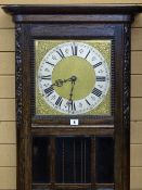 A 1930's OAK ENCASED TRIPLE WEIGHT LONGCASE CLOCK having a brass and silvered dial and with a nine
