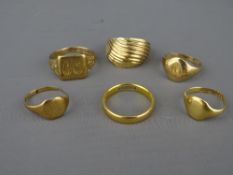 A TWENTY TWO CARAT GOLD NARROW WEDDING BAND, 4 grms and a parcel of five gold rings, mixed carats,