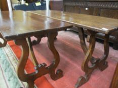 A NEAR PAIR OF CONTINENTAL WALNUT TABLES, the rectangular tops on lyre end supports and shaped under