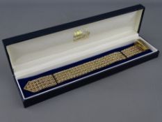 A NINE CARAT GOLD WOVEN LINK BRACELET, 2 cms wide, 50 grms, hallmarked Birmingham 1965