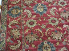 A LARGE RED GROUND FLORAL PATTERNED CARPET, 3.6 x 2.9 metres