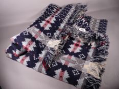 A TRADITIONAL WELSH WOOLLEN BLANKET in various blues and greys, 220 x 216 cms approximately