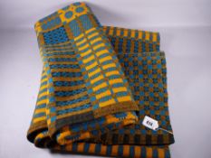 A TRADITIONAL WELSH WOOLLEN BLANKET in blue, black and mustard tones, 175 x 220 cms approximately (