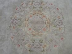 A WASHED CHINESE CARPET, light ground with floral pattern, 7.62 x 3.96 metres (measurements as per