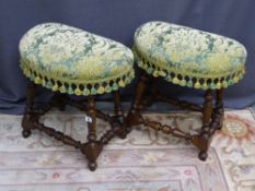 A PAIR OF EUROPEAN OAK & WALNUT STOOLS, having kidney shaped tassel edged upholstered tops, on