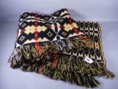 A TRADITIONAL WELSH WOOLLEN BLANKET in yellow, black and red tones, 215 x 152 cms approximately (