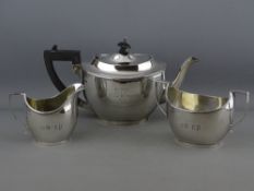A THREE PIECE SILVER TEA SERVICE, each piece of oval plain form and each piece inscribed, the teapot