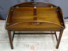 A CONTEMPORARY HARDWOOD BUTLER'S TRAY ON STAND with glass top protector, 58 cms high (handles up),