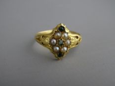 A LADY'S EIGHTEEN CARAT GOLD SEED PEARL & PERIDOT CLUSTER RING, 2.4 grms, size 'M/N'