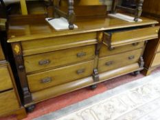 A LATE VICTORIAN MAHOGANY SIDEBOARD of six drawers on substantial turned bun feet, 90 cms high