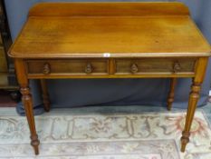 A VICTORIAN MAHOGANY RAILBACK SIDE TABLE with two drawers and corner turned and reeded supports, 106