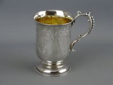 A FINE BRIGHT CUT SILVER MUG with gilded interior, a shaped handle of graduated beadwork and with