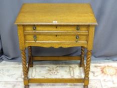 A VINTAGE OAK TWO DRAWER CUTLERY TABLE on barley twist and block supports (no contents), 76.5 cms