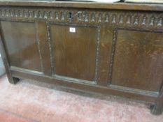 AN 18th CENTURY OAK BLANKET CHEST, panelled top front and sides with simple carved detail to the