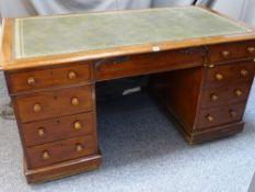 A LATE VICTORIAN MAHOGANY TWIN PEDESTAL DESK with green gilt tooled leather insert to the top,