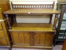 AN EDWARDIAN MAHOGANY DUMB WAITER with gallery back on turned shelf supports with twin lower