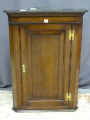 A WELL PRESENTED REPRODUCTION OAK FLAT FRONTED HANGING CORNER CUPBOARD, single chamfered panelled