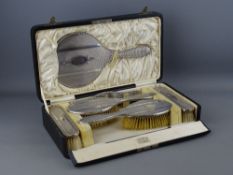 A FINE SIX PIECE CASED MANICURE SET, all pieces with fine quality silver backs, all marked for
