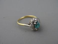 AN EIGHTEEN CARAT GOLD BLUE QUARTZ & DIAMOND OVAL CLUSTER DRESS RING, 3.5 grms gross, size 'N'