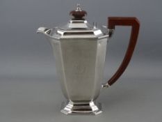 A SILVER COFFEE POT of oblong plain form with a stepped base, composition handle and knop, 19 troy