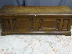 A LARGE CONTINENTAL WALNUT BLANKET CHEST, the inset panels with deep moulding, on corner bracket