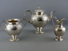 AN EXCELLENT MARTIN HALL & CO SILVER PLATED THREE PIECE PEDESTAL TEASET, chased and relief