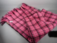 A TASSEL EDGED TRADITION STYLE WELSH WOOLLEN BLANKET, pink ground with black and white zig zag