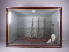 A CASED MODEL OF A LATE 19th/EARLY 20th CENTURY FOUR MASTED VESSEL with full rigging and three other