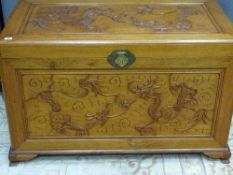 AN EXCELLENT ORIENTAL CAMPHOR WOOD CHEST with dragon design to the front and top, two interior