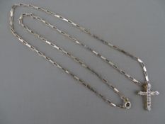 AN EIGHTEEN CARAT GOLD CROSS, encrusted with twelve round cut diamonds, 2 grms gross and a 925