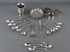 A SILVER CHRISTENING MUG (damage), 2.2 troy ozs, a quantity of silver cutlery, mainly spoons,