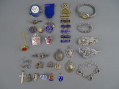 A MIXED GROUP OF MAINLY SILVER CHARMS, BADGES & FOB PENDANTS with four items of marcasite