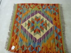 A VEGETABLE DYE WOOL CHOBI KELIM RUG, single central block diamond with colourful border and