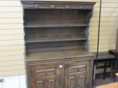 European oak canopy topped dresser with chamfered panel base cupboards, 174 cms high, 126 cms