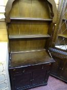 Small polished wood dome topped dresser