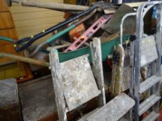 Wheelbarrow and contents, small parcel of long handled garden tools, four various sized wood and