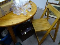 Circular pine table and four folding chairs