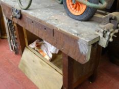 Vintage wooden workbench with two bolt-on vices and a built-in Woden 192 vice
