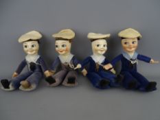 Four vintage cloth sailors, their cap bands marked 'Nevasa' (2), 'Lord Warden' and 'Lord Nelson