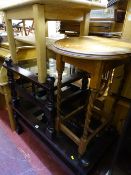 Dark wood glass topped coffee table with lower slats, another matching but smaller, a light wood