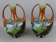 Pair of Arnhem pottery vases, twin handled with Art Nouveau decoration