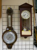 Polished balloon barometer and a modern Vienna style wall clock