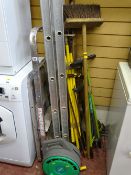Parcel of long handled garden tools, metal stepladder and one other multi-way ladder