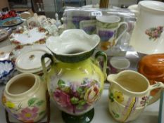 Two pottery biscuit barrels, a twin handled vase, two boxed china mug and coaster sets etc
