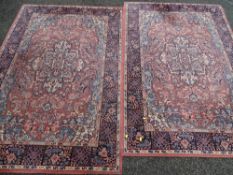Two similar patterned rugs