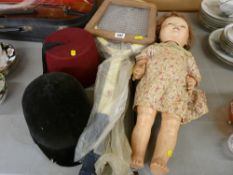 Vintage tennis and badminton racquets, a Pedigree doll, a child's horse riding hat and a fez