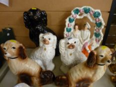 Jackfield style pottery spaniel, two pairs of other comforter dogs and a Staffs flatback figural